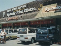 IDN Bali 1990OCT WRLFC WGT 065  Must be because KFC sells beer. Fair dinkum, I reckon the shop owner is onto something there. Chicken and BEER!!! : 1990, 1990 World Grog Tour, Asia, Bali, Date, Indonesia, Month, October, Places, Rugby League, Sports, Wests Rugby League Football Club, Year